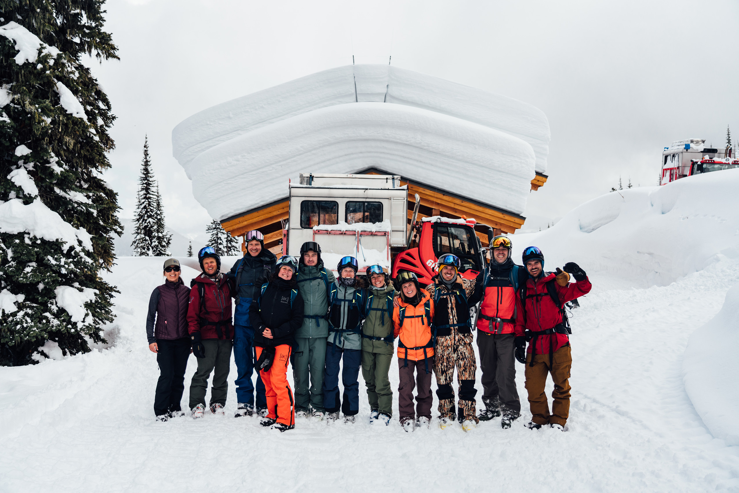 The Ski Journal at K3 Cat Ski. Left to right: Cat driver Natasha, Guide Todd, Matt Wibby, Jessie Lu Galbraith, Christopher McKenna, Lilly Ritter, Natalie Merrill, Natalie Krewin, Ben Eberhardt, Ryan Arp, and Danny Prout. Photo: Colby Mesick