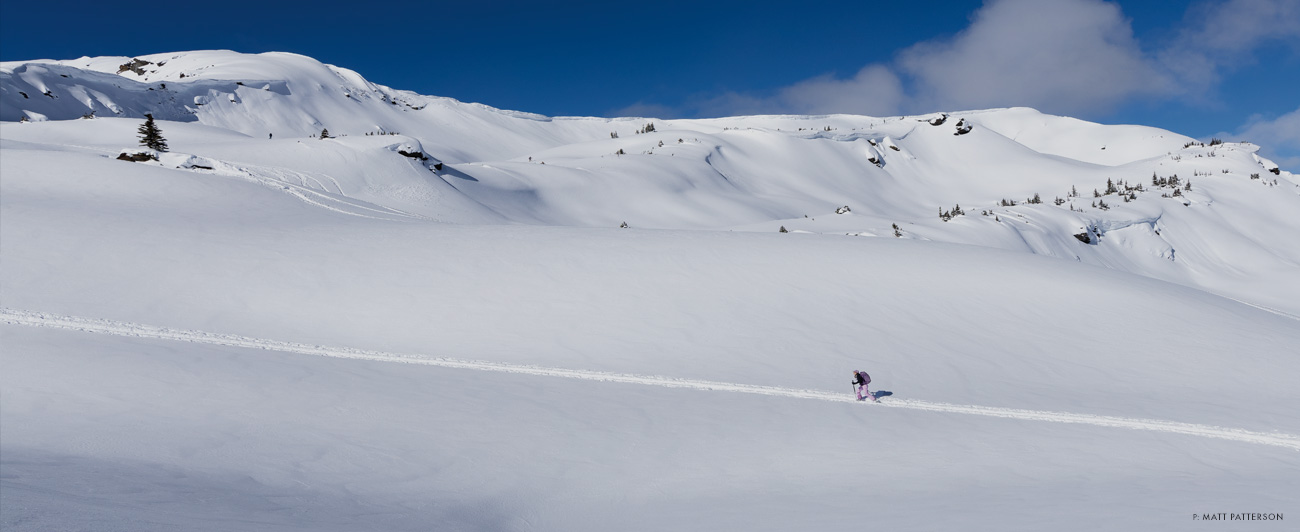 Lily Krass Ritter enjoying blue skies and a fresh coat of paint in British Columbia’s Selkirk Mountains. Photo: Matt Patterson