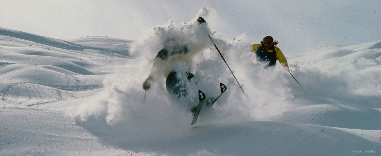“Spring of 1979—one of the first times I skied for Marko taking photos of John Falkiner and myself in Verbier [Switzerland]. Our local shop had given us a few clothes to wear—Powderhorn from Jackson Hole, WY. For some reason, Western stuff in the Alps was super cool back then. It was kinda dust on crust, six inches of fresh on frozen bumps directly above Clambin. I liked to ski in front of John ‘cause I felt safer in case he bit it. Also, he was a lot bigger than me. Marko skied down and around, gave me the wave and there we were: double-page spread in Powder in the fall issue. They got the credit wrong, but back in the day you had to take the slide out of its plastic sleeve to print, so that shit happened sometimes. Marko was pretty livid, but I didn’t care. That spring session is what helped launch our careers and friendships that still exist today, it was the very beginning of our collaboration which became Team Clambin.” —Ace Kvale