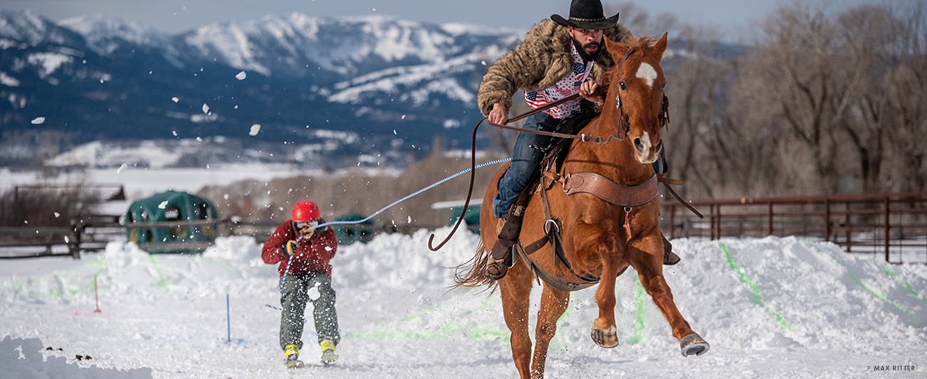 Cowboy Mike and his horse Tug saddle up for a practice run in Teton Valley, ID. Even in training, Michael Miller’s signature fur jacket is always in play.