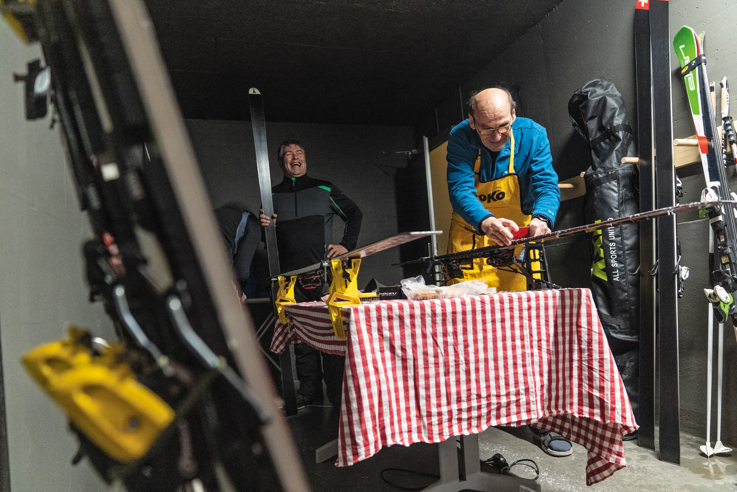 Veteran racers wax their skis the night before the Inferno Downhill, the longest amateur downhill ski race in the world. The first Inferno race took place with just 17 competitors in 1928, dropping over 7,000 feet from the Schilthorn to the Lauterbrunnen over almost 10 miles. The historical race, which routinely sells out, is capped at 1,850 competitors sent off in 12-second increments. Mürren, Switzerland. Photo: Cam McLeod 