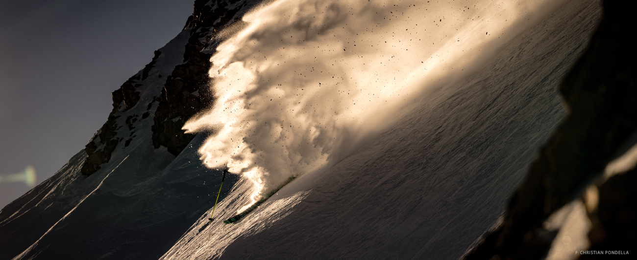 “Bernie Rosow carves a turn through early season wind buff at Mammoth Mountain, CA. The sun hung low in the sky and the light only grazed the top of the slope for an hour or so each morning.” Photo: Christian Pondella